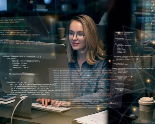 Programmer working on coding and software development on a computer in